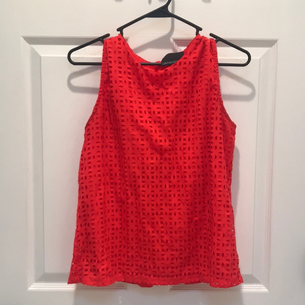 Cynthia Rowley, small. Orange sleeveless shirt with buttons in back